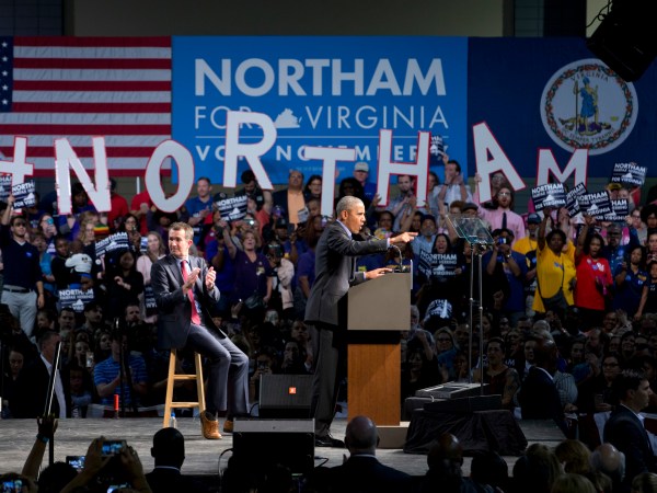 Former President Barack Obama, right, gestures during a rally with Democratic gubernatorial candidate Lt. Gov., Ralph Northam, in Richmond, Va., Thursday, Oct. 19, 2017.  (AP Photo/Steve Helber)