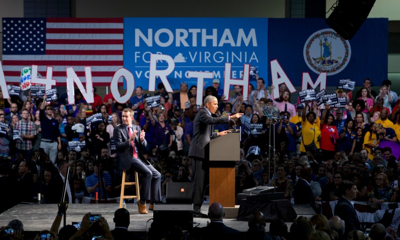 Former President Barack Obama, right, gestures during a rally with Democratic gubernatorial candidate Lt. Gov., Ralph Northam, in Richmond, Va., Thursday, Oct. 19, 2017.  (AP Photo/Steve Helber)