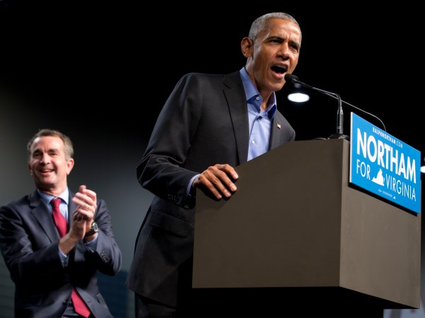 Former President Barack Obama, right, waves to the crowd along with Democratic gubernatorial candidate Lt. Gov., Ralph Northam, during a rally in Richmond, Va., Thursday, Oct. 19, 2017.  (AP Photo/Steve Helber)