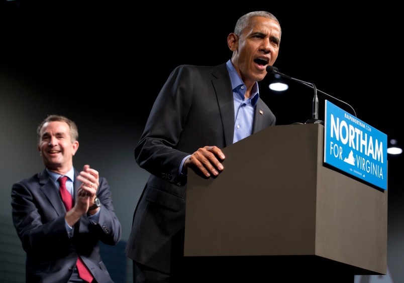 Former President Barack Obama, right, waves to the crowd along with Democratic gubernatorial candidate Lt. Gov., Ralph Northam, during a rally in Richmond, Va., Thursday, Oct. 19, 2017.  (AP Photo/Steve Helber)