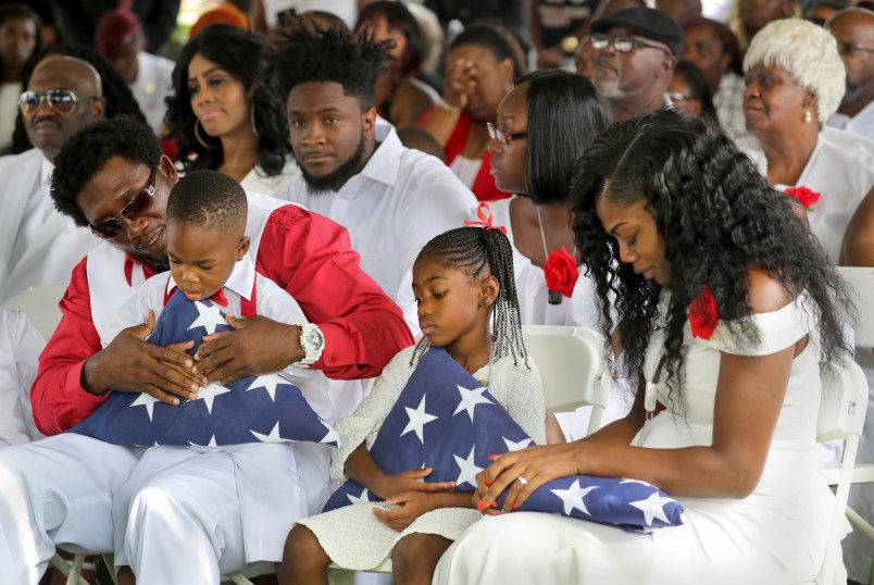 (L to R) Richard Johnson Sr. holds La David Johnson Jr. Ah'Leesya Johnson, and Myeshia Johnson, the wife of Army Sgt. La David Johnson. He was buried at Hollywood Memorial Gardens. Johnson was working with U.S. Army Special Forces in Northwestern Africa when Islamic militants ambushed them on Oct. 4, near the Niger border. Mike Stocker, South Florida Sun-Sentinel...SOUTH FLORIDA OUT; NO MAGS; NO SALES; NO INTERNET; NO TV...