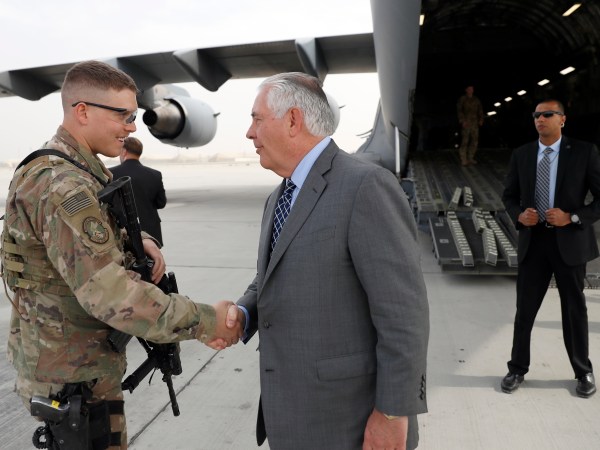 Secretary of State Rex Tillerson greets a U.S. Air Force security forces airman, before he departs, Monday, Oct. 23, 2017, at Bagram Air Field, Afghanistan. (AP Photo/Alex Brandon, Pool)