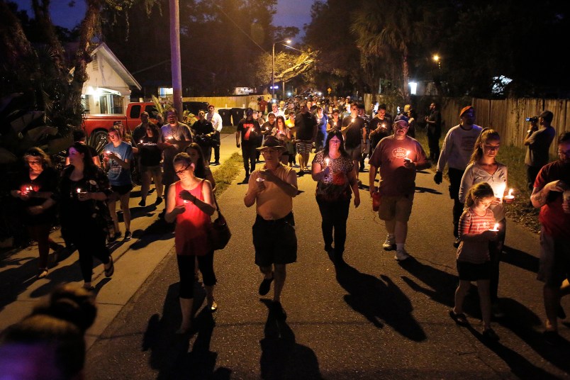 A peaceful march that began on east New Orleans Avenue was held during the candlelight vigil for the three victims who were killed in the recent shootings in the Seminole Heights neighborhood in Tampa on Sunday, October 22, 2017.   (Octavio Jones/The Tampa Bay Times via AP)  TAMPA OUT; CITRUS COUNTY OUT; PORT CHARLOTTE OUT; BROOKSVILLE HERNANDO TODAY OUT