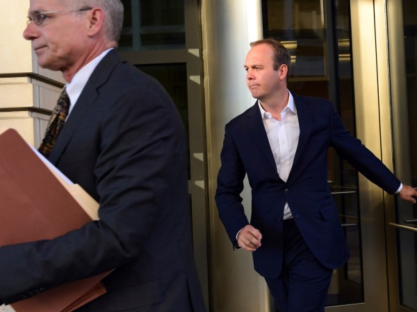 President Donald Trump's former business associate Rick Gates, right, leaves federal court in Washington, Monday, Oct. 30, 2017. (AP Photo/Susan Walsh)