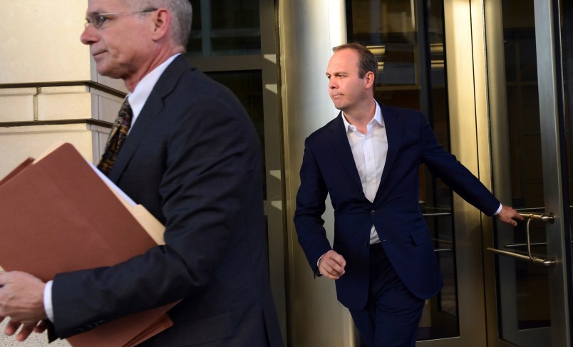 President Donald Trump's former business associate Rick Gates, right, leaves federal court in Washington, Monday, Oct. 30, 2017. (AP Photo/Susan Walsh)