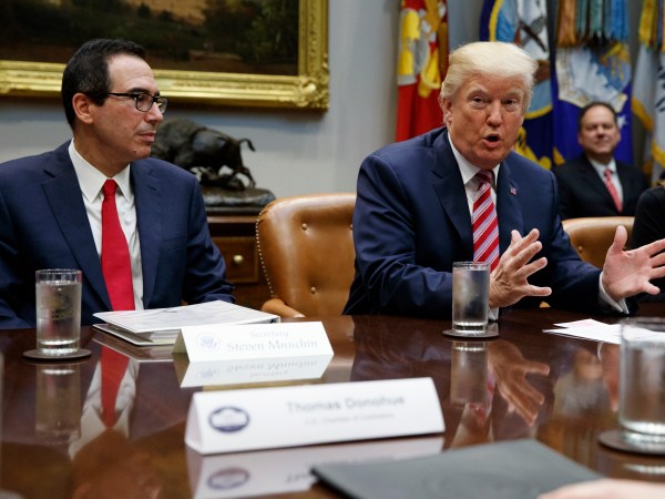 Treasury Secretary Steve Mnuchin listens as President Donald Trump speaks during a meeting on tax policy with business leaders in the Roosevelt Room of the White House, Tuesday, Oct. 31, 2017, in Washington. (AP Photo/Evan Vucci)