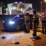 Las Vegas Police stand at the scene of a shooting along the Las Vegas Strip, Monday, Oct. 2, 2017, in Las Vegas. (AP Photo/John Locher)