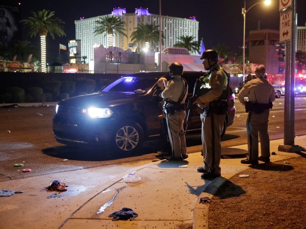 Las Vegas Police stand at the scene of a shooting along the Las Vegas Strip, Monday, Oct. 2, 2017, in Las Vegas. (AP Photo/John Locher)