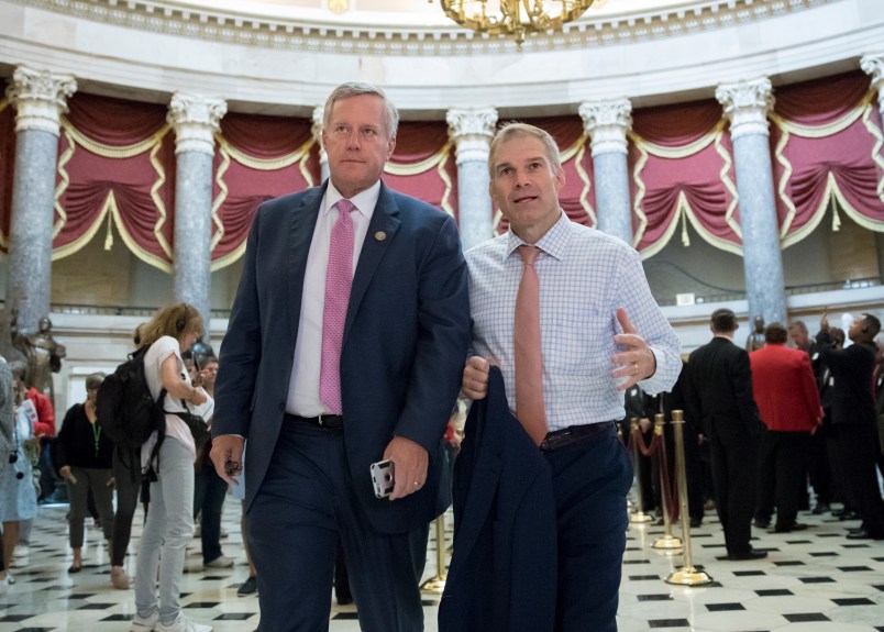 Rep. Mark Meadows, R-N.C., chairman of the conservative House Freedom Caucus, and Rep. Jim Jordan, R-Ohio, a key member of the group, walk through Statuary Hall at the Capitol in Washington, Wednesday, Sept. 13, 2017. With President Donald Trump wanting a legislative solution to replace the Deferred Action for Childhood Arrivals program, Meadows has said he will put together a working group to craft a conservative immigration plan. (AP Photo/J. Scott Applewhite)