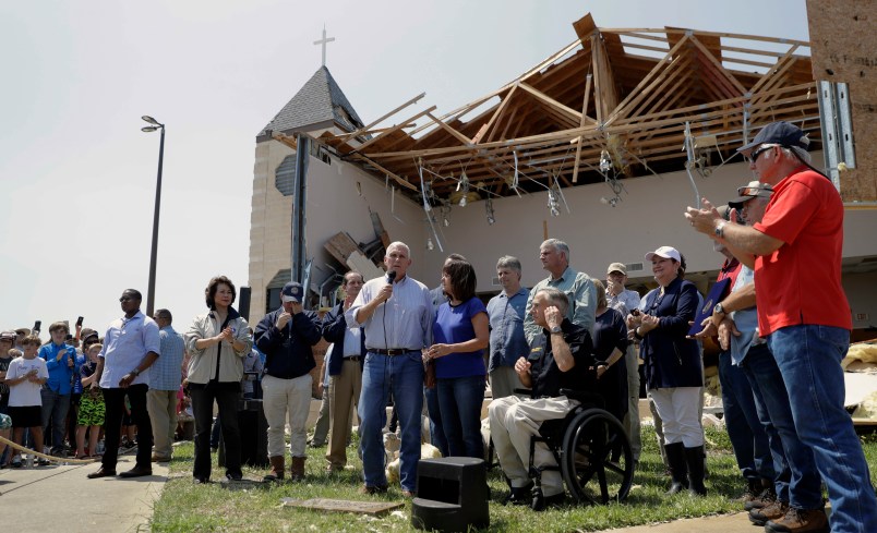 MOVE AT 9:00 AM EASTERN TUESDAY NOV. 7 - FILE - in this Aug. 31, 2017 file photo, Vice President Mike Pence,with his wife Karen, speak to residents affected by Hurricane Harvey during a visit to the First Baptist Church, in Rockport, Texas. The church, which was hit by Harvey, has not filed a lawsuit against the Federal Emergency Management Agency, challenging the agency's policy of denying disaster aid to repair or rebuild places of worship as others have. When disaster strikes, religious institutions like churches and synagogues often form a community’s front line of response while working alongside the Federal Emergency Management Agency. Places of worship are routinely denied FEMA aid when it comes time to repair and rebuild their own damaged sanctuaries. (AP Photo/Eric Gay File)