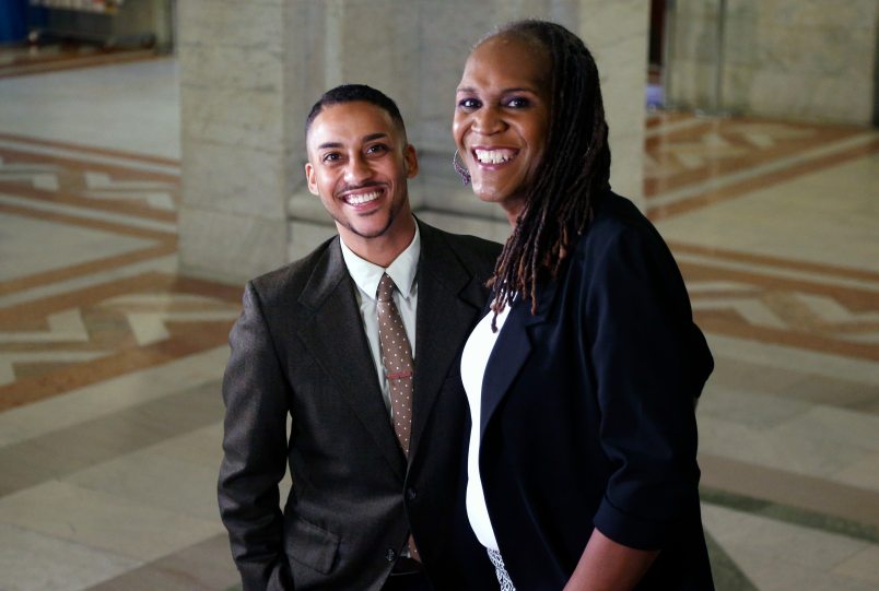 Newly elected city council members Phillipe Cunningham, left ,and Andrea Jenkins pose after an interview Thursday, Nov. 9, at City Hall in Minneapolis. The two black transgender representatives-elect add to what advocacy groups have described as a banner election for transgender people in public office. (AP Photo/Jim Mone)