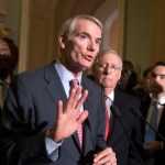 Sen. Rob Portman, R-Ohio, a member of the Senate Finance Committee, joins Sen.Tim Scott, R-S.C., left, and Majority Leader Mitch McConnell, R-Ky., to talk about work on overhauling the nation's tax code, on Capitol Hill in Washington, Tuesday, Nov. 14, 2017. (AP Photo/J. Scott Applewhite)
