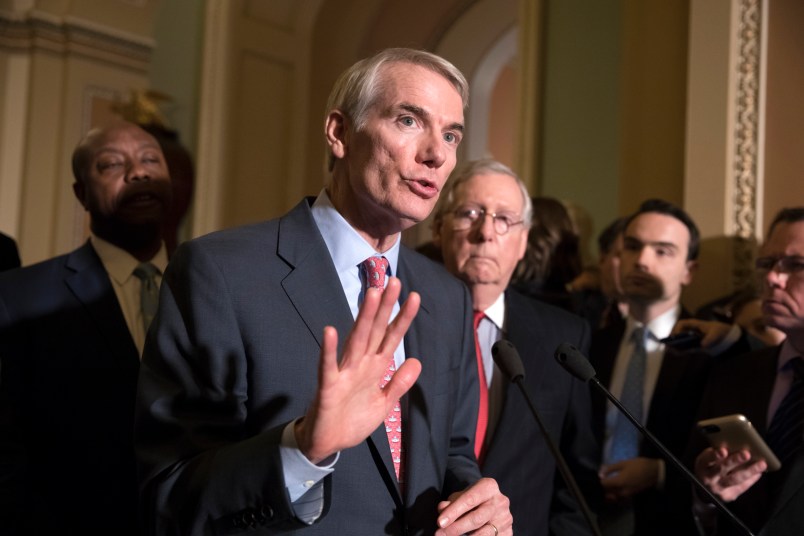 Sen. Rob Portman, R-Ohio, a member of the Senate Finance Committee, joins Sen.Tim Scott, R-S.C., left, and Majority Leader Mitch McConnell, R-Ky., to talk about work on overhauling the nation's tax code, on Capitol Hill in Washington, Tuesday, Nov. 14, 2017. (AP Photo/J. Scott Applewhite)