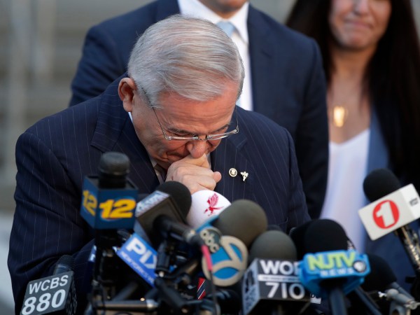 U.S. Sen. Bob Menendez fights tears as he speaks to reporters outside Martin Luther King Jr. Federal Courthouse after U.S. District Judge William H. Walls declared a mistrial in Menendez' federal corruption trial, Thursday, Nov. 16, 2017, in Newark, N.J. (AP Photo/Julio Cortez)