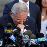 U.S. Sen. Bob Menendez fights tears as he speaks to reporters outside Martin Luther King Jr. Federal Courthouse after U.S. District Judge William H. Walls declared a mistrial in Menendez' federal corruption trial, Thursday, Nov. 16, 2017, in Newark, N.J. (AP Photo/Julio Cortez)