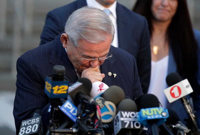 U.S. Sen. Bob Menendez fights tears as he speaks to reporters outside Martin Luther King Jr. Federal Courthouse after U.S. District Judge William H. Walls declared a mistrial in Menendez' federal corruption trial, Thursday, Nov. 16, 2017, in Newark, N.J. (AP Photo/Julio Cortez)
