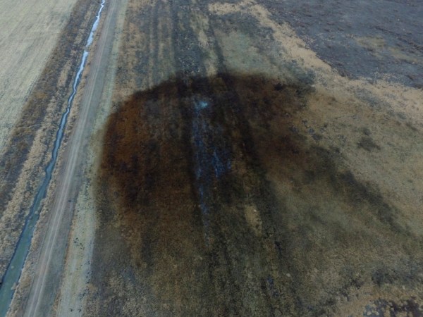 This aerial photo shows spills from TransCanada Corp.'s Keystone pipeline, Friday, Nov. 17, 2017, that leaked an estimated 210,000 gallons of oil onto agricultural land in northeastern South Dakota, near Amherst, S.D., the company and state regulators said Thursday, but state officials don't believe the leak polluted any surface water bodies or drinking water systems. Crews shut down the pipeline Thursday morning and activated emergency response procedures after a drop in pressure was detected resulting from the leak south of a pump station in Marshall County, TransCanada said in a statement. The cause was being investigated. (DroneBase via AP)