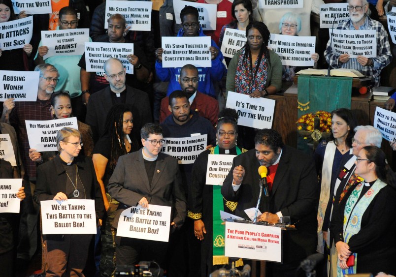 The Rev. William J. Barber II, a leader of The Poor People's Campaign and a prominent voice among liberal Christians, speaks at a rally held in opposition to Republican U.S. Senate candidate Roy Moore at a church in Birmingham, Ala., on Saturday, Nov. 18, 2017. The demonstration came two days after conservative Christian leaders stood with Moore at another event. (AP Photo/Jay Reeves)