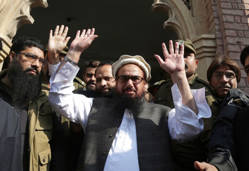 Hafiz Saeed, head of the Pakistani religious party, Jamaat-ud-Dawa, waves on his arrival to a court in Lahore, Pakistan, Tuesday, Nov. 21, 2017. The U.S. has offered a $10 million bounty for Saeed and the U.N. Security Council labeled his party a terrorist front group in 2008. (AP Photo/K.M. Chaudary)