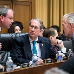 House Judiciary Committee Chairman Bob Goodlatte, R-Va., center, is joined by, from left, Rep. Lamar Smith, R-Texas, a staff aide, and Rep. Trey Gowdy, R-S.C., far right, as the panel meets to craft a Republican bill to expand gun owners' rights, the first gun legislation since mass shootings in Las Vegas and Texas killed more than 80 people, on Capitol Hill in Washington, Wednesday, Nov. 29, 2017.  (AP Photo/J. Scott Applewhite)