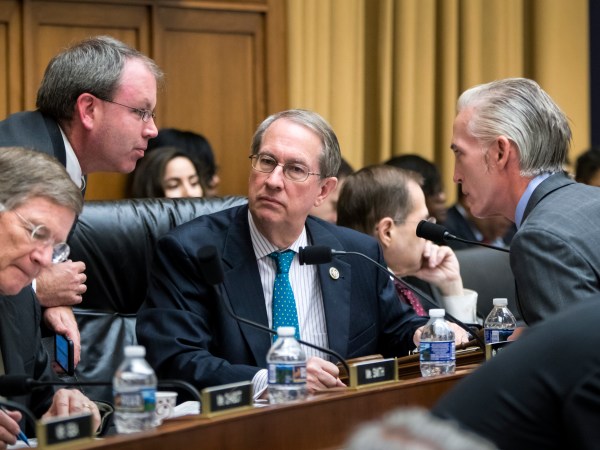 House Judiciary Committee Chairman Bob Goodlatte, R-Va., center, is joined by, from left, Rep. Lamar Smith, R-Texas, a staff aide, and Rep. Trey Gowdy, R-S.C., far right, as the panel meets to craft a Republican bill to expand gun owners' rights, the first gun legislation since mass shootings in Las Vegas and Texas killed more than 80 people, on Capitol Hill in Washington, Wednesday, Nov. 29, 2017.  (AP Photo/J. Scott Applewhite)