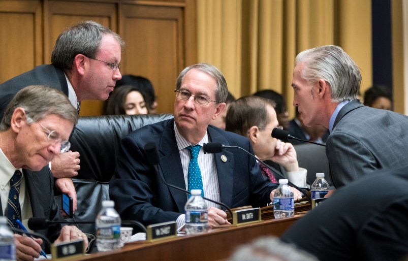 House Judiciary Committee Chairman Bob Goodlatte, R-Va., center, is joined by, from left, Rep. Lamar Smith, R-Texas, a staff aide, and Rep. Trey Gowdy, R-S.C., far right, as the panel meets to craft a Republican bill to expand gun owners' rights, the first gun legislation since mass shootings in Las Vegas and Texas killed more than 80 people, on Capitol Hill in Washington, Wednesday, Nov. 29, 2017.  (AP Photo/J. Scott Applewhite)