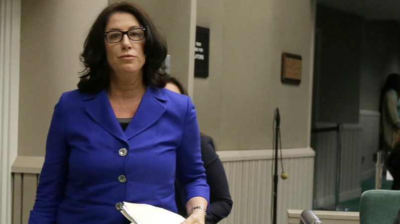 HOLD TO MOVE WITH STORY - In this photo taken Tuesday, Nov. 28, 2017, Christine Pelosi, chair of the California Democratic Party's women's caucus, walks to the dais to speak before the Assembly Rules Subcommittee on Harassment, Discrimination and Retaliation Prevent and Response, in Sacramento, Calif. Using some inflammatory language, Pelosi accused the legislature of covering up sex crimes. (AP Photo/Rich Pedroncelli)