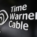 FILE - In this May 26, 2015, file photo, the Time Warner Cable corporate logo is displayed at a company store, in New York. On Monday, April 25, 2016, the Justice Department approved Charter’s bid to buy Time Warner Cable and create another cable giant. Monday’s OK comes with conditions meant to preserve competition from online services. Additional approvals are required, but expected, before the deal closes. (AP Photo/Mark Lennihan, File)