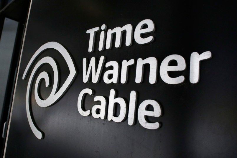 FILE - In this May 26, 2015, file photo, the Time Warner Cable corporate logo is displayed at a company store, in New York. On Monday, April 25, 2016, the Justice Department approved Charter’s bid to buy Time Warner Cable and create another cable giant. Monday’s OK comes with conditions meant to preserve competition from online services. Additional approvals are required, but expected, before the deal closes. (AP Photo/Mark Lennihan, File)