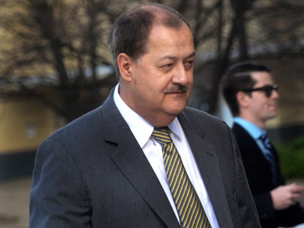 FILE - In a Wednesday, April 6, 2016, file photo, former Massey CEO Don Blankenship is escorted by Homeland Security officers from the Robert C. Byrd U.S. Courthouse in Charleston, W. Va. Attorneys for Blankenship and the federal government head to court this week in the ex-coal operator's appeal of his conviction in connection with the deadliest U.S. mine disaster in four decades. Oral arguments are scheduled for Wednesday, Oct. 26, before a three-judge panel at the 4th U.S. Circuit Court of Appeals in Richmond, Va. (F. Brian Ferguson/Charleston Gazette-Mail via AP, File)