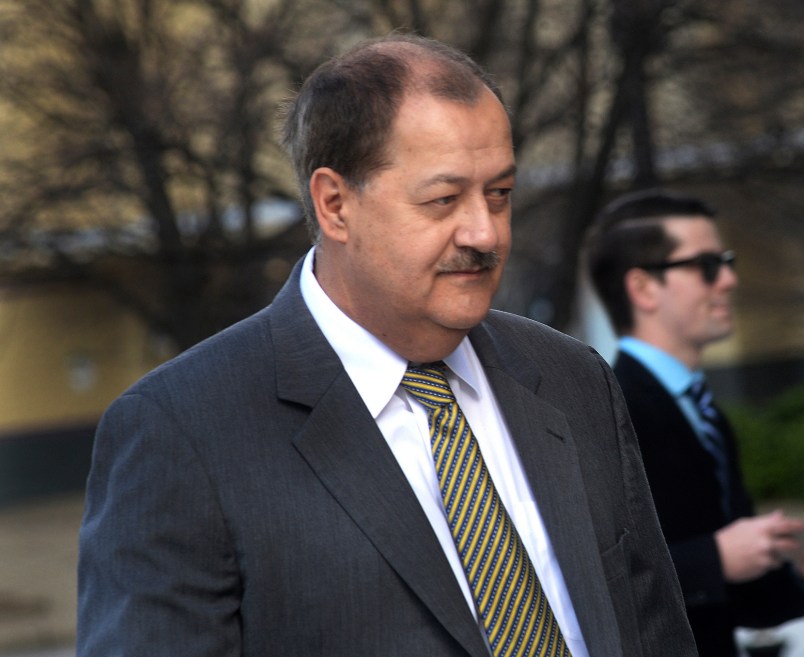 FILE - In a Wednesday, April 6, 2016, file photo, former Massey CEO Don Blankenship is escorted by Homeland Security officers from the Robert C. Byrd U.S. Courthouse in Charleston, W. Va. Attorneys for Blankenship and the federal government head to court this week in the ex-coal operator's appeal of his conviction in connection with the deadliest U.S. mine disaster in four decades. Oral arguments are scheduled for Wednesday, Oct. 26, before a three-judge panel at the 4th U.S. Circuit Court of Appeals in Richmond, Va. (F. Brian Ferguson/Charleston Gazette-Mail via AP, File)
