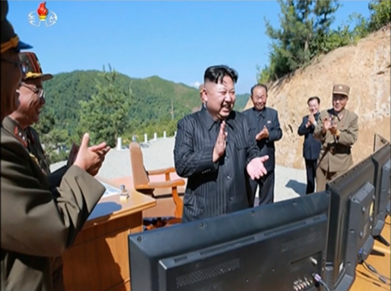 ** LET'S CHECK AND SEE IF WE HAVE KNS VERSION OF THIS PHOTO ** This image made from video of a news bulletin aired by North Korea's KRT on Tuesday, July 4, 2017, shows what was said to be North Korea leader Kim Jung Un, center, applauding after the launch of a Hwasong-14 intercontinental ballistic missile (ICBM) in North Korea's northwest. Kim Jong Un has something his father and grandfather could only dream of, an intercontinental ballistic missile capable of striking the United States with a nuclear weapon. Independent journalists were not given access to cover the event depicted in this photo.  (KRT via AP Video, File)