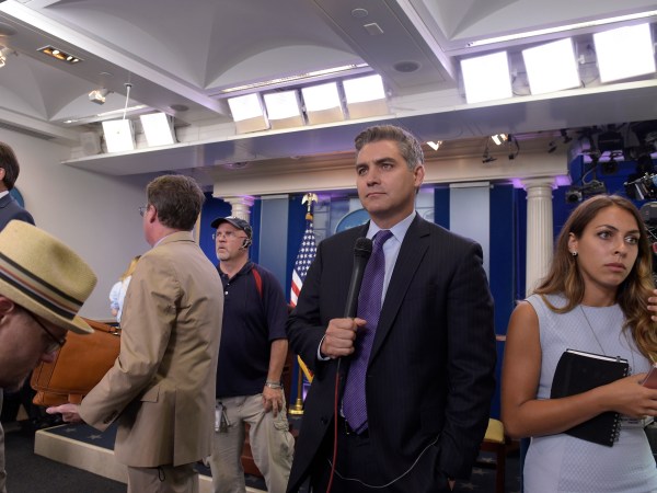 Jim Acosta of CNN waits to do a live shot following the daily briefing at the White House in Washington, Wednesday, Aug. 2, 2017. (AP Photo/Susan Walsh)