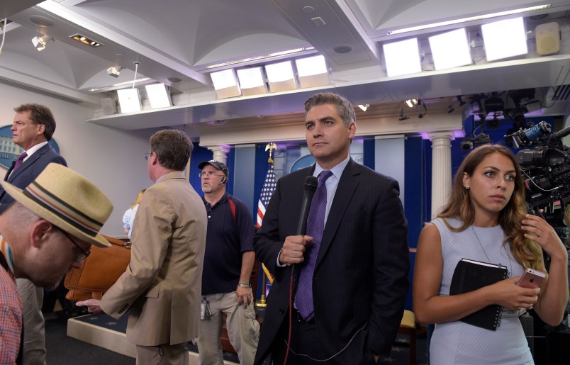 Jim Acosta of CNN waits to do a live shot following the daily briefing at the White House in Washington, Wednesday, Aug. 2, 2017. (AP Photo/Susan Walsh)