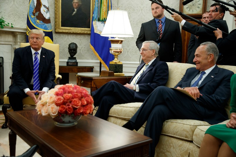 Senate Majority Leader Mitch McConnell, R-Ky., center, and Senate Minority Leader Chuck Schumer, D-N.Y., right, listen as President Donald Trump speaks during a meeting with Congressional leaders in the Oval Office of the White House, Wednesday, Sept. 6, 2017, in Washington. (AP Photo/Evan Vucci)