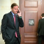 Sen. Richard Blumenthal, D-Conn., a member of the Senate Judiciary Committee, makes a phone call as Donald Trump Jr., interviewed behind closed doors by committee staff investigating the meddling and possible Russian links to President Donald Trump's 2016 presidential campaign, at the Capitol in Washington, Thursday, Sept. 7, 2017. Trump Jr. released a series of emails in July that detailed preparations for a June 2016 meeting with a Russian lawyer and others where he was expecting to get damaging information about Democratic candidate Hillary Clinton.   (AP Photo/J. Scott Applewhite)