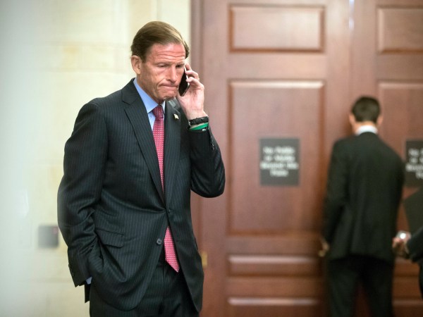 Sen. Richard Blumenthal, D-Conn., a member of the Senate Judiciary Committee, makes a phone call as Donald Trump Jr., interviewed behind closed doors by committee staff investigating the meddling and possible Russian links to President Donald Trump's 2016 presidential campaign, at the Capitol in Washington, Thursday, Sept. 7, 2017. Trump Jr. released a series of emails in July that detailed preparations for a June 2016 meeting with a Russian lawyer and others where he was expecting to get damaging information about Democratic candidate Hillary Clinton.   (AP Photo/J. Scott Applewhite)