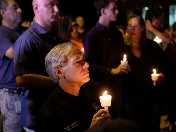 Texas Governor Greg Abbott attended a candlelight vigil in Sutherland Springs, Texas on Sunday, November 5, 2017 after a shooter opened fire on a church and killed 26 people. Photo by Laura Skelding
