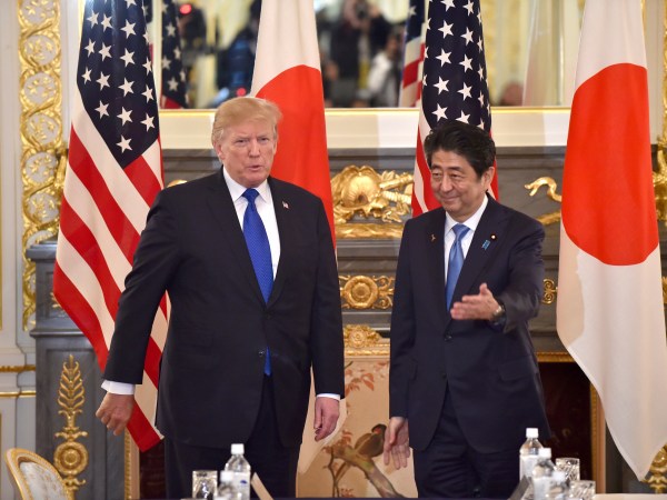 US President Donald Trump (L) is led by Japanese Prime Minister Shinzo Abe (R) before a summit meeting at Akasaka Palace in Tokyo on November 6, 2017. / AFP PHOTO / POOL / Kazuhiro NOGI /// Attn photo desk (AFP POOL-Trump/Abe summit meeting-7) Herewith AFP POOL photo, 110607F. 110607F: US President Donald Trump (L ) is led by Japanese Prime Minister Shinzo Abe (R ) before a summit meeting at Akasaka Guest House in Tokyo on November 6, 2017. AFP PHOTO / POOL / Kazuhiro NOGICheers, Nogi/tokpix