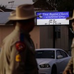 Law enforcement officials work at the scene of a shooting at the First Baptist Church of Sutherland Springs, Monday, Nov. 6, 2017, in Sutherland Springs, Texas. A man dressed in black tactical-style gear and armed with an assault rifle opened fire inside the church in the small South Texas community on Sunday, killing and wounding many. The dead ranged in age from 5 to 72 years old. (AP Photo/Eric Gay)