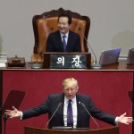 U.S. President Donald Trump delivers a speech as South Korea's National Assembly Speaker Chung Sye-kyun, top, listens at the National Assembly in Seoul, South Korea, Wednesday, Nov. 8, 2017. (AP Photo/Lee Jin-man, Pool)