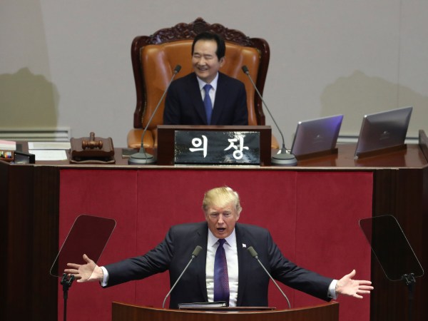 U.S. President Donald Trump delivers a speech as South Korea's National Assembly Speaker Chung Sye-kyun, top, listens at the National Assembly in Seoul, South Korea, Wednesday, Nov. 8, 2017. (AP Photo/Lee Jin-man, Pool)