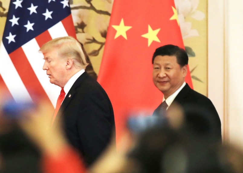 U.S. President Donald Trump (L) and China’s President Xi Jinping head for a joint press conference at the Great Hall of the People in Beijing on Nov. 9, 2017.( The Yomiuri Shimbun via AP Images )
