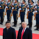 U.S. President Donald Trump, right, walks with Chinese President Xi Jinping during the welcome ceremony at the Great Hall of the people in Beijing, Thursday, Nov. 9, 2017. (AP Photo/Andy Wong)