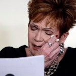 Beverly Young Nelson the latest accuser of Alabama Republican Roy Moore, reads her statement at a news conference, in New York, Monday, Nov. 13, 2017. Nelson says she was a 16-year-old high school student working at a restaurant where Moore was a regular. She says Moore groped her, touched her breasts and locked the door to keep her inside his car. She said he squeezed her neck while trying to push her head toward his crotch and that he tried to pull her shirt off. (AP Photo/Richard Drew)