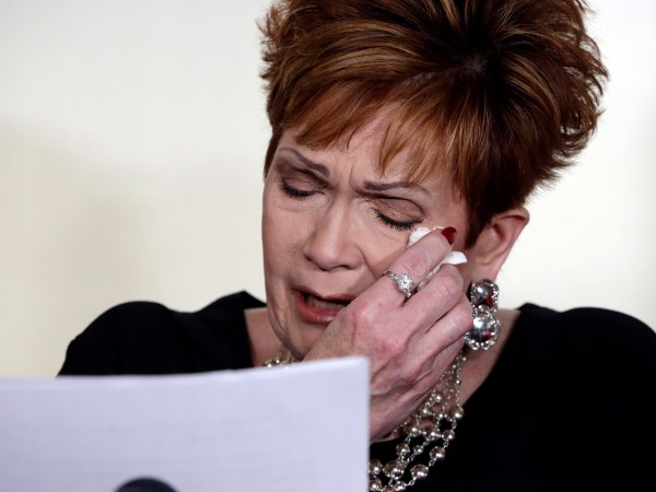 Beverly Young Nelson the latest accuser of Alabama Republican Roy Moore, reads her statement at a news conference, in New York, Monday, Nov. 13, 2017. Nelson says she was a 16-year-old high school student working at a restaurant where Moore was a regular. She says Moore groped her, touched her breasts and locked the door to keep her inside his car. She said he squeezed her neck while trying to push her head toward his crotch and that he tried to pull her shirt off. (AP Photo/Richard Drew)