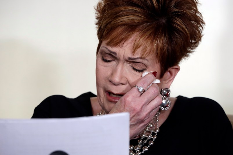 Beverly Young Nelson the latest accuser of Alabama Republican Roy Moore, reads her statement at a news conference, in New York, Monday, Nov. 13, 2017. Nelson says she was a 16-year-old high school student working at a restaurant where Moore was a regular. She says Moore groped her, touched her breasts and locked the door to keep her inside his car. She said he squeezed her neck while trying to push her head toward his crotch and that he tried to pull her shirt off. (AP Photo/Richard Drew)