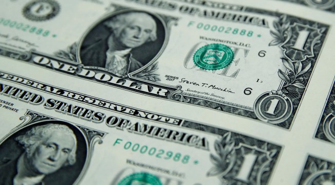 Treasury Secretary Steven Mnuchin's signatures is seen on new dollar bills, Wednesday, Nov. 15, 2017, at the Bureau of Engraving and Printing in Washington. The new Mnuchin-Carranza notes, which are a new series of 2017, 50-subject $1 notes, will be sent to the Federal Reserve to issue into circulation. (AP Photo/Jacquelyn Martin)