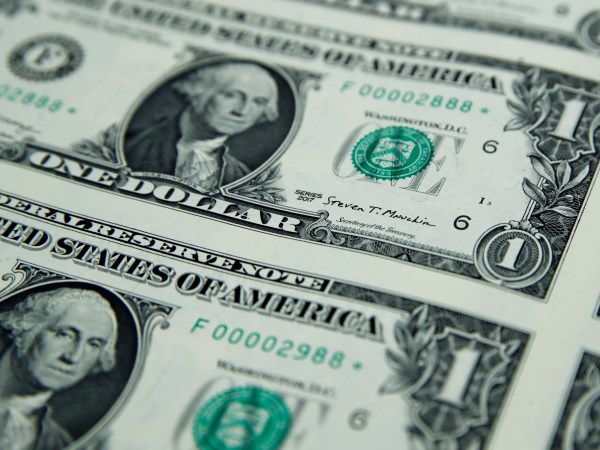 Treasury Secretary Steven Mnuchin's signatures is seen on new dollar bills, Wednesday, Nov. 15, 2017, at the Bureau of Engraving and Printing in Washington. The new Mnuchin-Carranza notes, which are a new series of 2017, 50-subject $1 notes, will be sent to the Federal Reserve to issue into circulation. (AP Photo/Jacquelyn Martin)