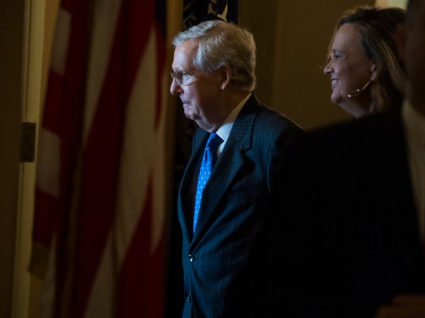 UNITED STATES - NOVEMBER 16: Senate Majority Leader Mitch McConnell, R-Ky., talks with an aide in the Capitol after the House passed the GOP's tax reform bill on November 16, 2017. (Photo By Tom Williams/CQ Roll Call)